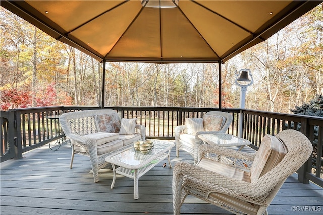 wooden deck featuring a gazebo and an outdoor living space