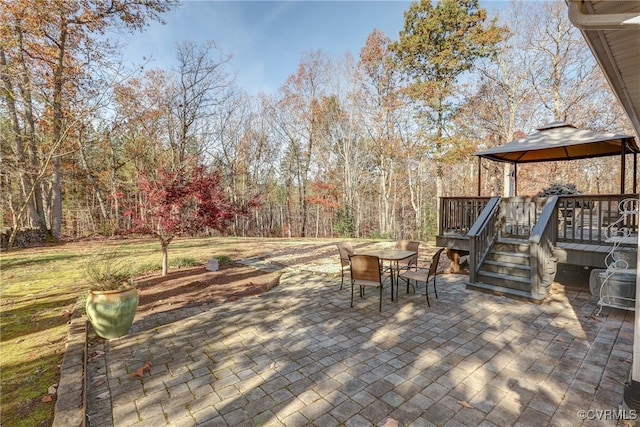 view of patio / terrace with outdoor dining space and a gazebo