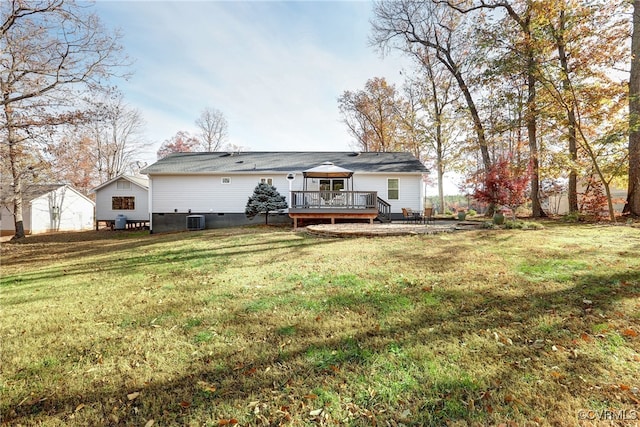 rear view of property featuring a yard, a gazebo, central AC unit, crawl space, and a wooden deck