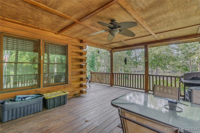 wooden terrace with ceiling fan and grilling area