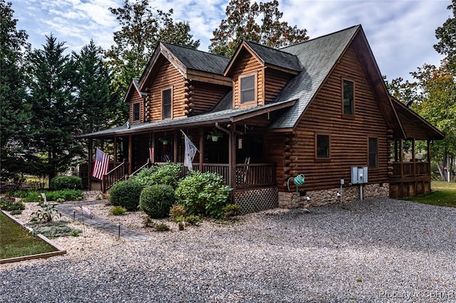 log cabin with a porch