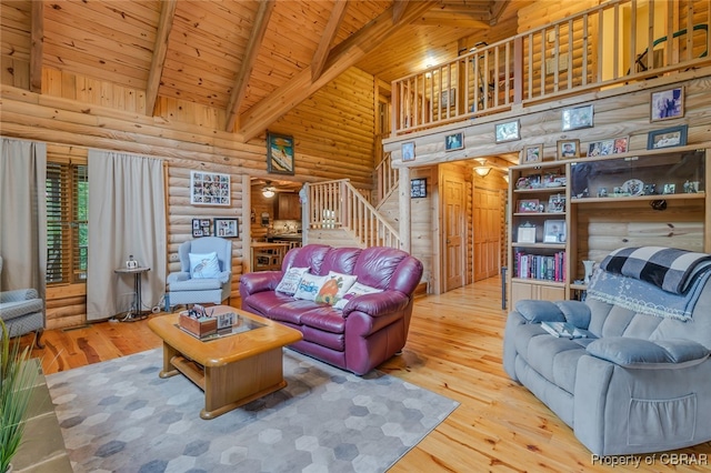 living room featuring hardwood / wood-style floors, high vaulted ceiling, wooden ceiling, and beam ceiling