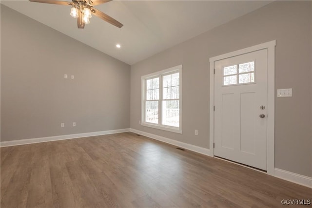 entrance foyer with lofted ceiling, wood-type flooring, and ceiling fan