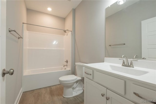 full bathroom with vanity, hardwood / wood-style floors, toilet, and shower / bath combination