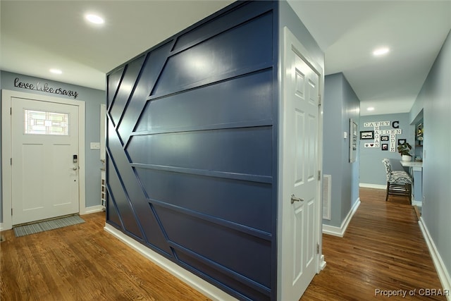 hall with dark hardwood / wood-style flooring