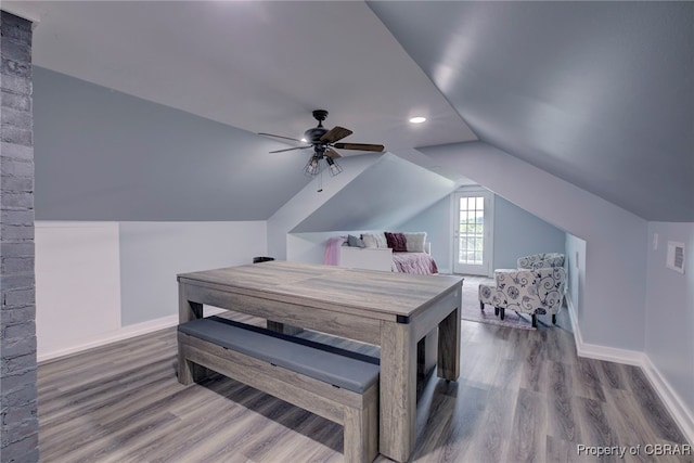 bedroom featuring wood-type flooring, ceiling fan, and lofted ceiling