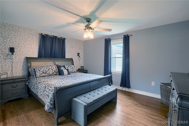 bedroom with ceiling fan and dark hardwood / wood-style floors