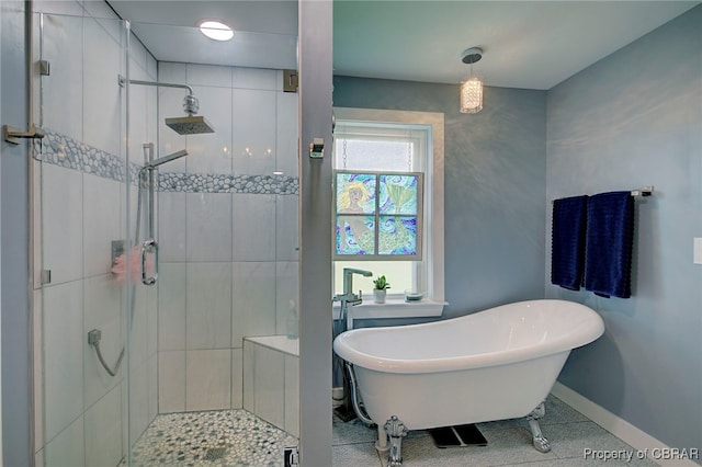 bathroom featuring tile patterned floors and shower with separate bathtub