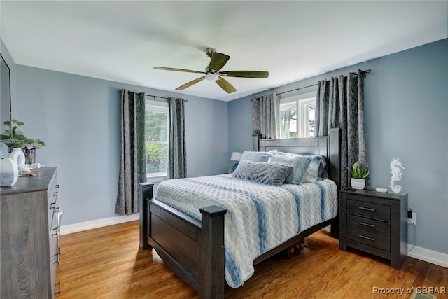 bedroom featuring light hardwood / wood-style floors and ceiling fan