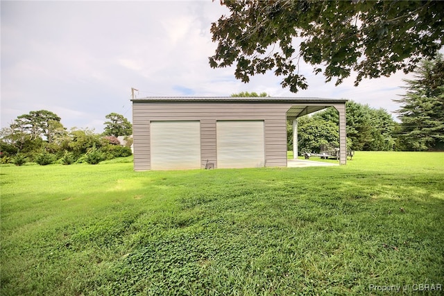 garage with a yard