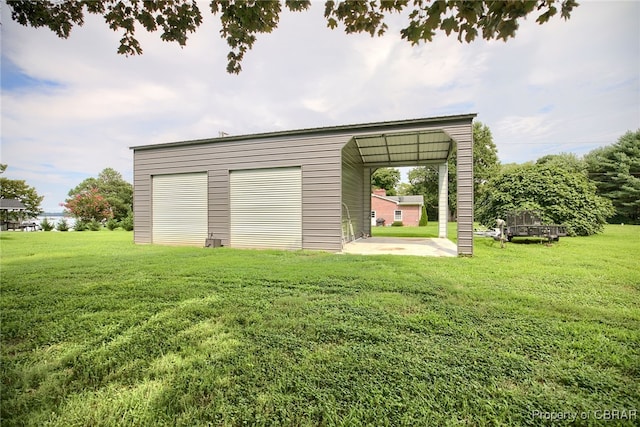 exterior space with a lawn and a carport