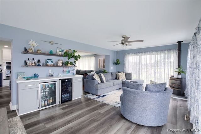 living room featuring bar area, wine cooler, and a wealth of natural light