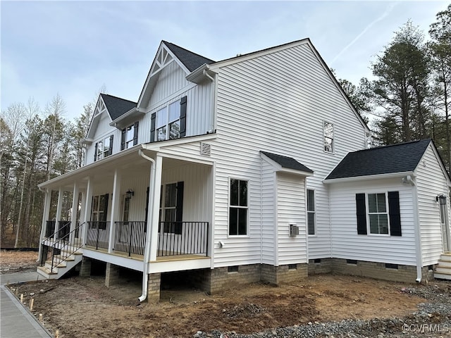 view of property exterior featuring a porch