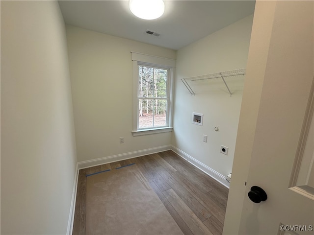 laundry area with hardwood / wood-style flooring, electric dryer hookup, and hookup for a washing machine