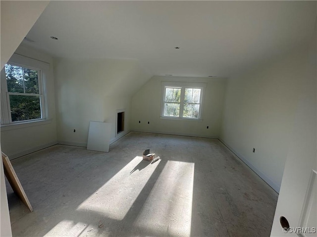 bonus room with vaulted ceiling