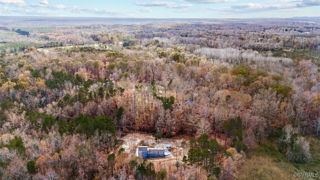 drone / aerial view featuring a forest view