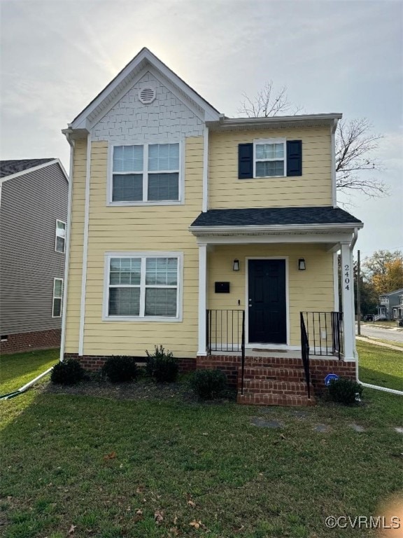 view of front of house featuring a porch and a front lawn