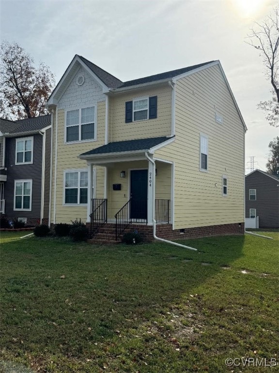 view of front of home with crawl space and a front yard