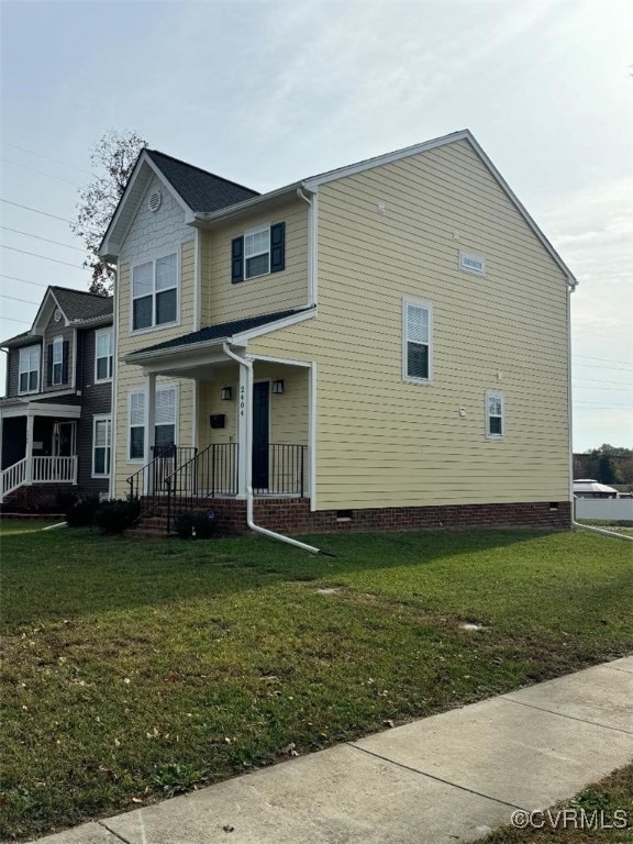 view of front of property with a porch and a front lawn