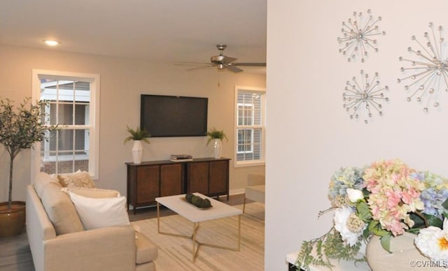 living area featuring recessed lighting, wood finished floors, a ceiling fan, and baseboards