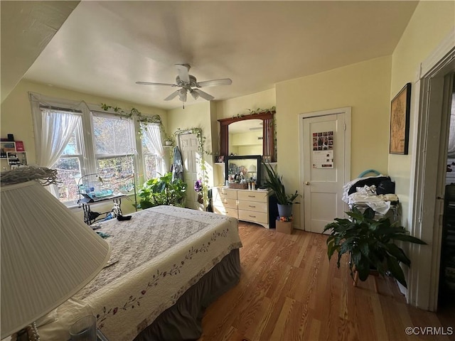 bedroom featuring hardwood / wood-style floors and ceiling fan