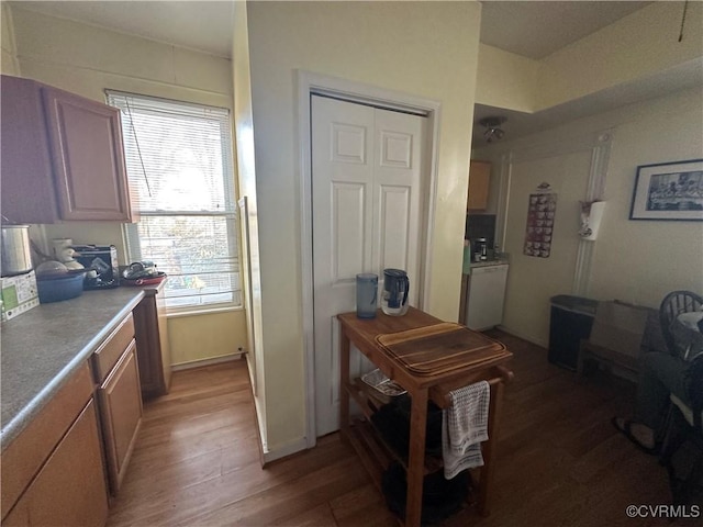 kitchen featuring light brown cabinets and hardwood / wood-style flooring