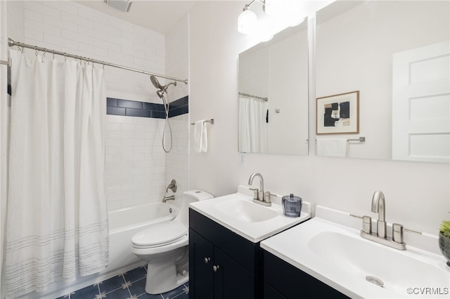 full bath with shower / bath combo, vanity, toilet, and tile patterned floors