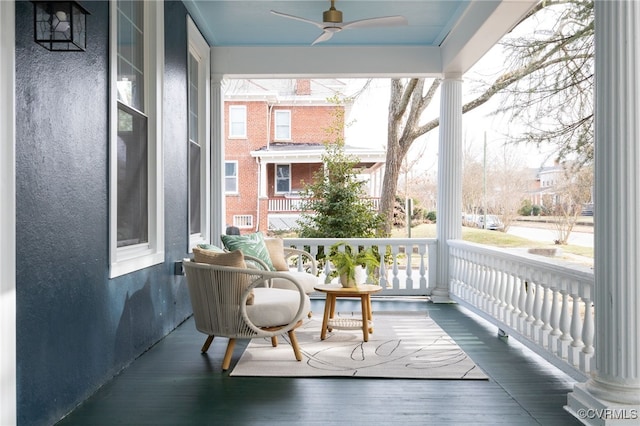 balcony featuring ceiling fan and a porch