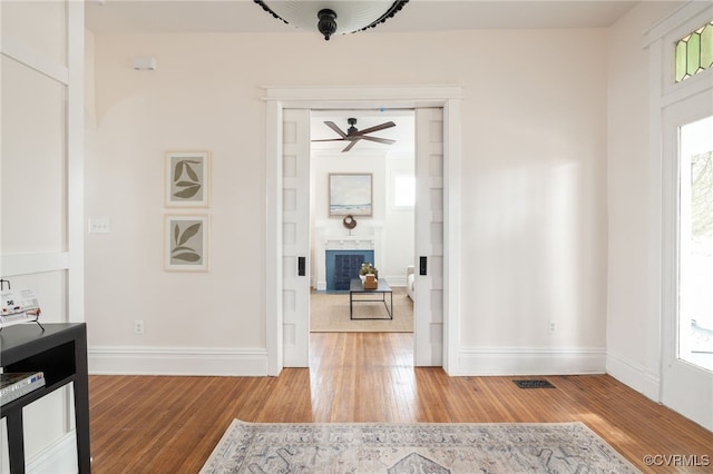 interior space featuring a healthy amount of sunlight, visible vents, and light wood finished floors