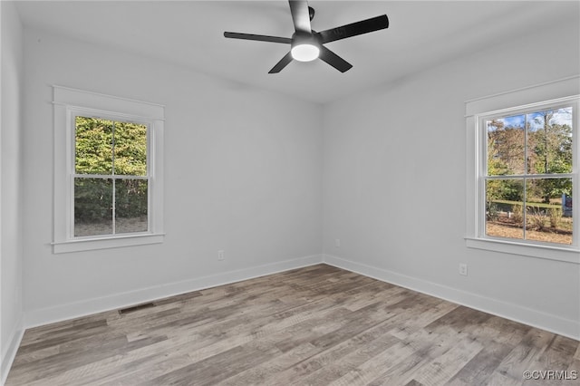 unfurnished room featuring ceiling fan and light hardwood / wood-style floors