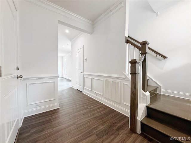 2047 Swiss Ln, Hayes, VA 23072 - stairway featuring a decorative wall, ornamental molding, wood finished floors, and a wainscoted wall