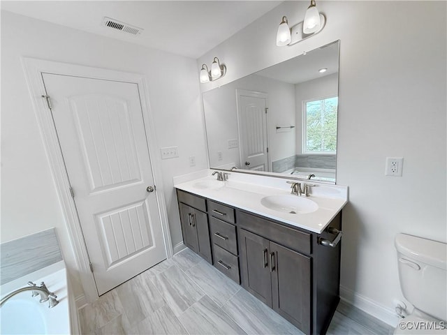 2047 Swiss Ln, Hayes, VA 23072 - bathroom featuring double vanity and a garden tub