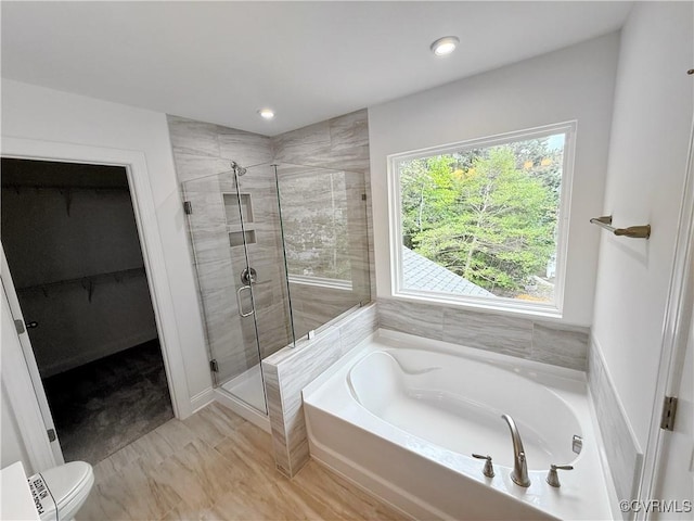 2047 Swiss Ln, Hayes, VA 23072 - bathroom featuring a garden tub, a shower stall, and a walk in closet