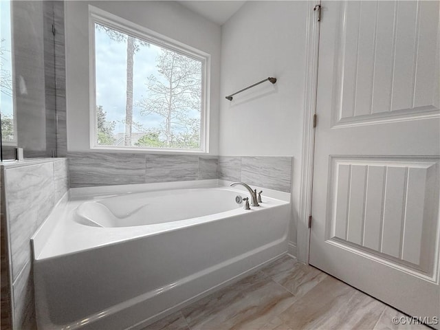2047 Swiss Ln, Hayes, VA 23072 - full bath with a garden tub and marble finish flooring