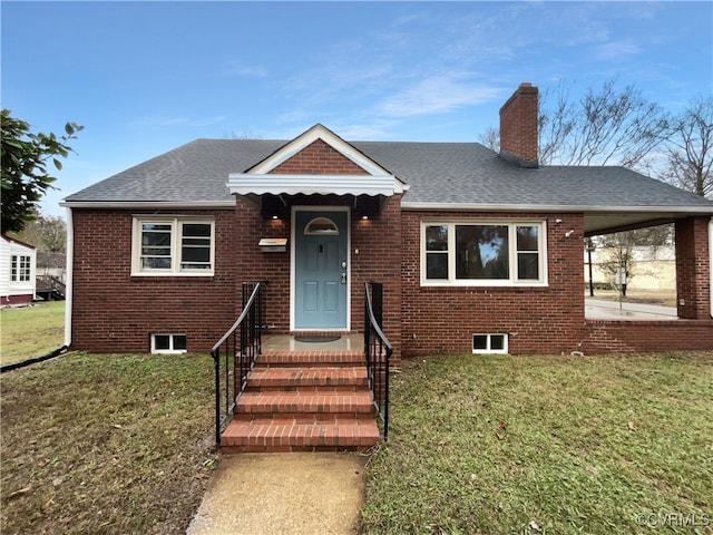 bungalow-style home with a front lawn