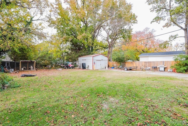 view of yard featuring a storage unit