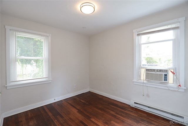 unfurnished room with baseboard heating, plenty of natural light, cooling unit, and dark hardwood / wood-style floors