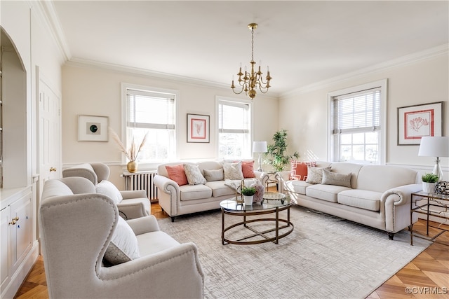 living room with a notable chandelier, radiator heating unit, and ornamental molding