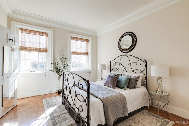 bedroom with light parquet flooring and crown molding