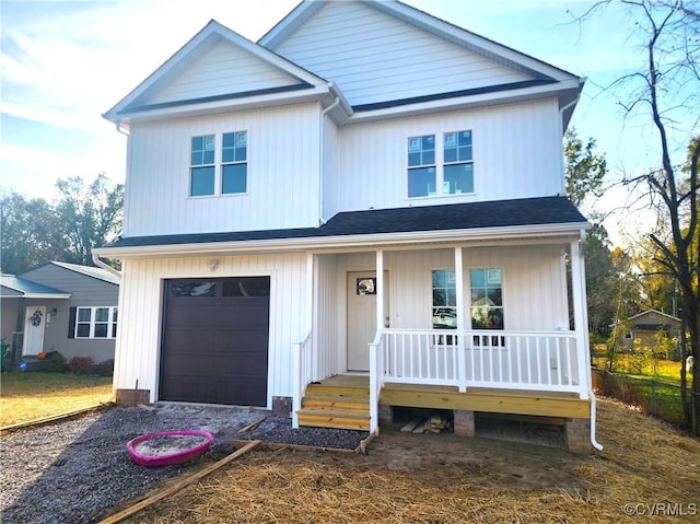 view of front of house featuring a garage and covered porch