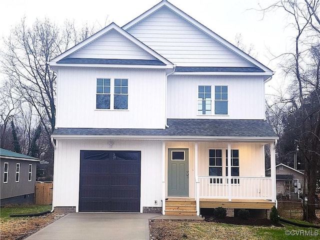 view of front facade featuring covered porch and a garage