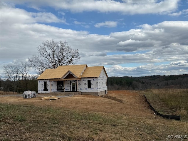 property under construction featuring a front lawn