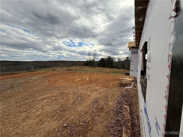 view of yard with a rural view