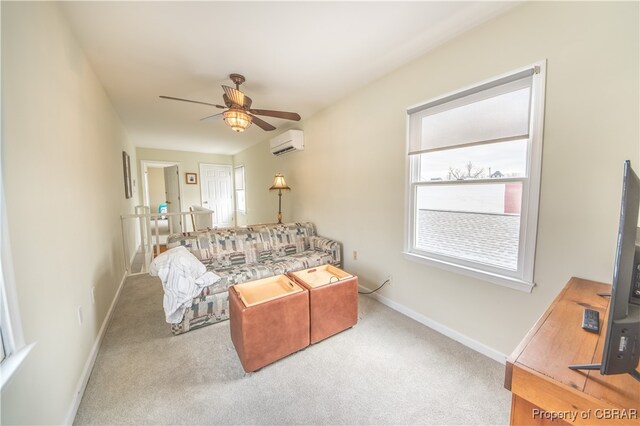 living room featuring a wall mounted air conditioner, carpet floors, and ceiling fan