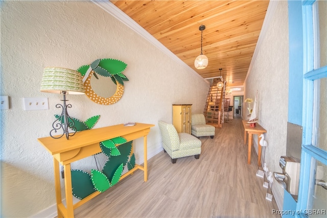 sitting room with crown molding, wooden ceiling, and hardwood / wood-style flooring