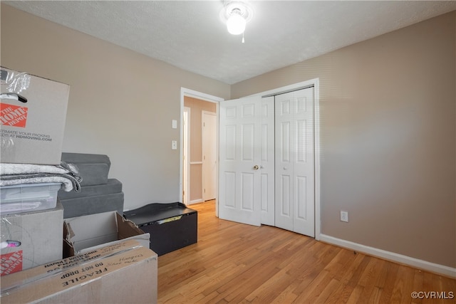 interior space with light hardwood / wood-style flooring and a textured ceiling