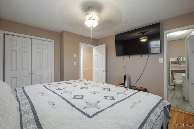 bedroom featuring a closet, ceiling fan, and hardwood / wood-style floors