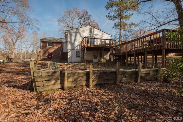 back of property with a wooden deck