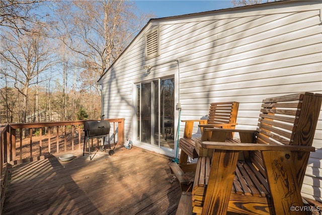 wooden deck with area for grilling