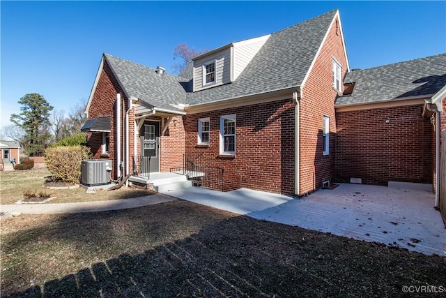 view of front of property featuring central AC and a patio area